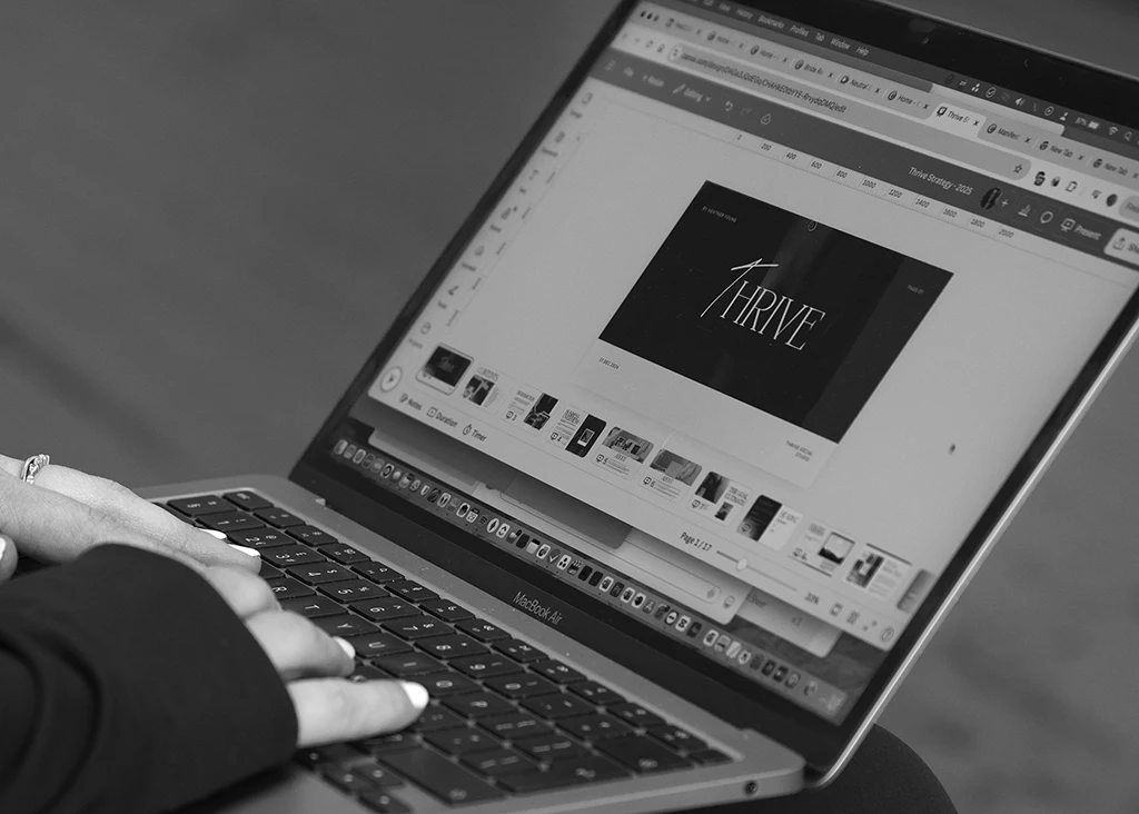 a person typing on a laptop - social media management